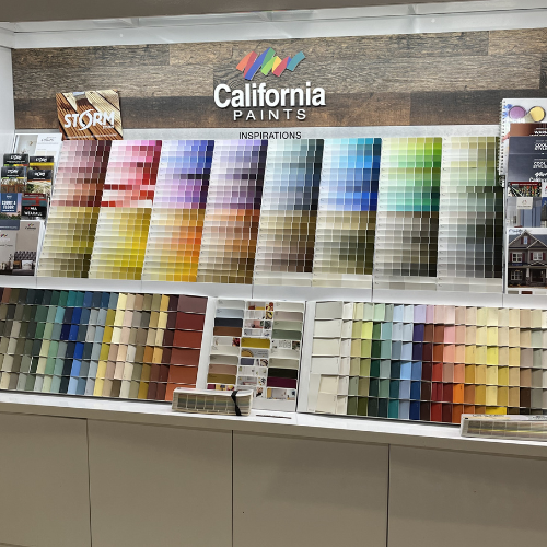 Display of California Paints color swatches arranged in a gradient. Rows feature diverse shades, from warm reds and yellows to cool blues and greens.